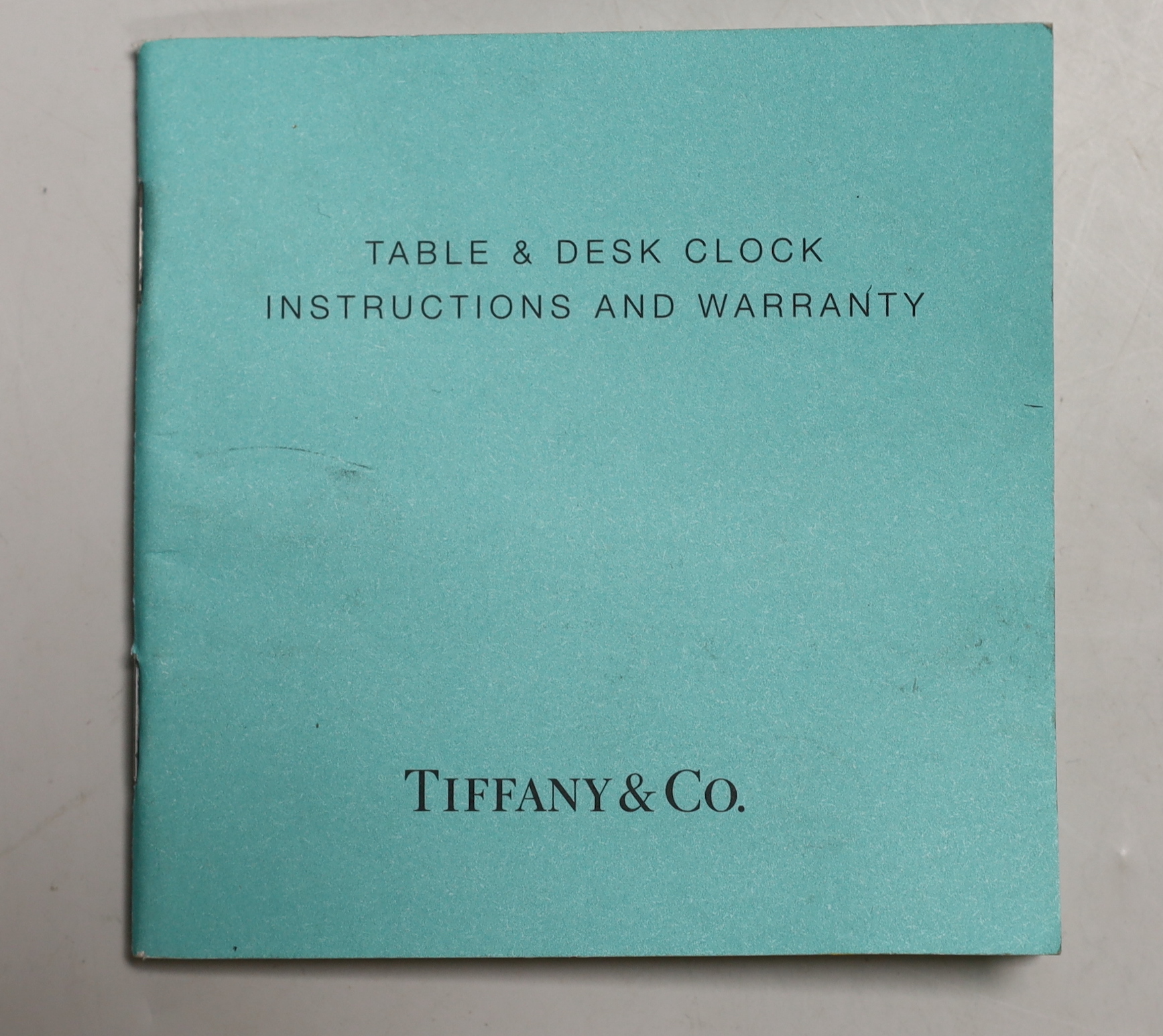 A Tiffany & Co. Swiss made brass clock, 14cm wide, 15.5cm high